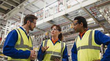 Workers in safety goggles