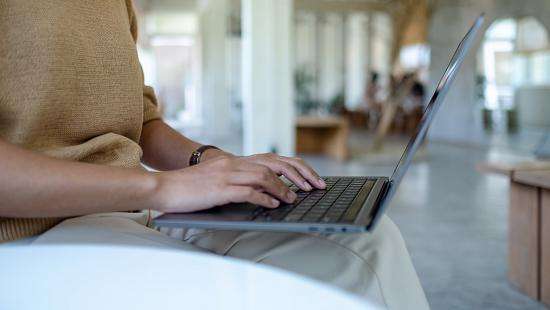 close up of person working on laptop